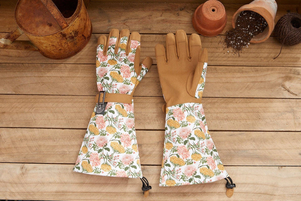 Barking Gardener Arm Saver Gloves with floral print cotton cuffs, tan synthetic leather palms, and pull cord closures.