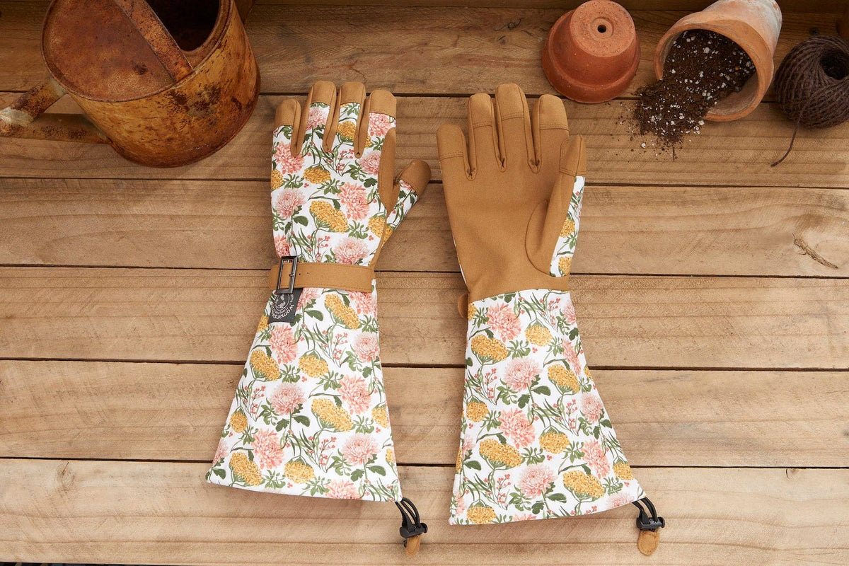 Barking Gardener Arm Saver Gloves with floral print cotton cuffs, tan synthetic leather palms, and pull cord closures.