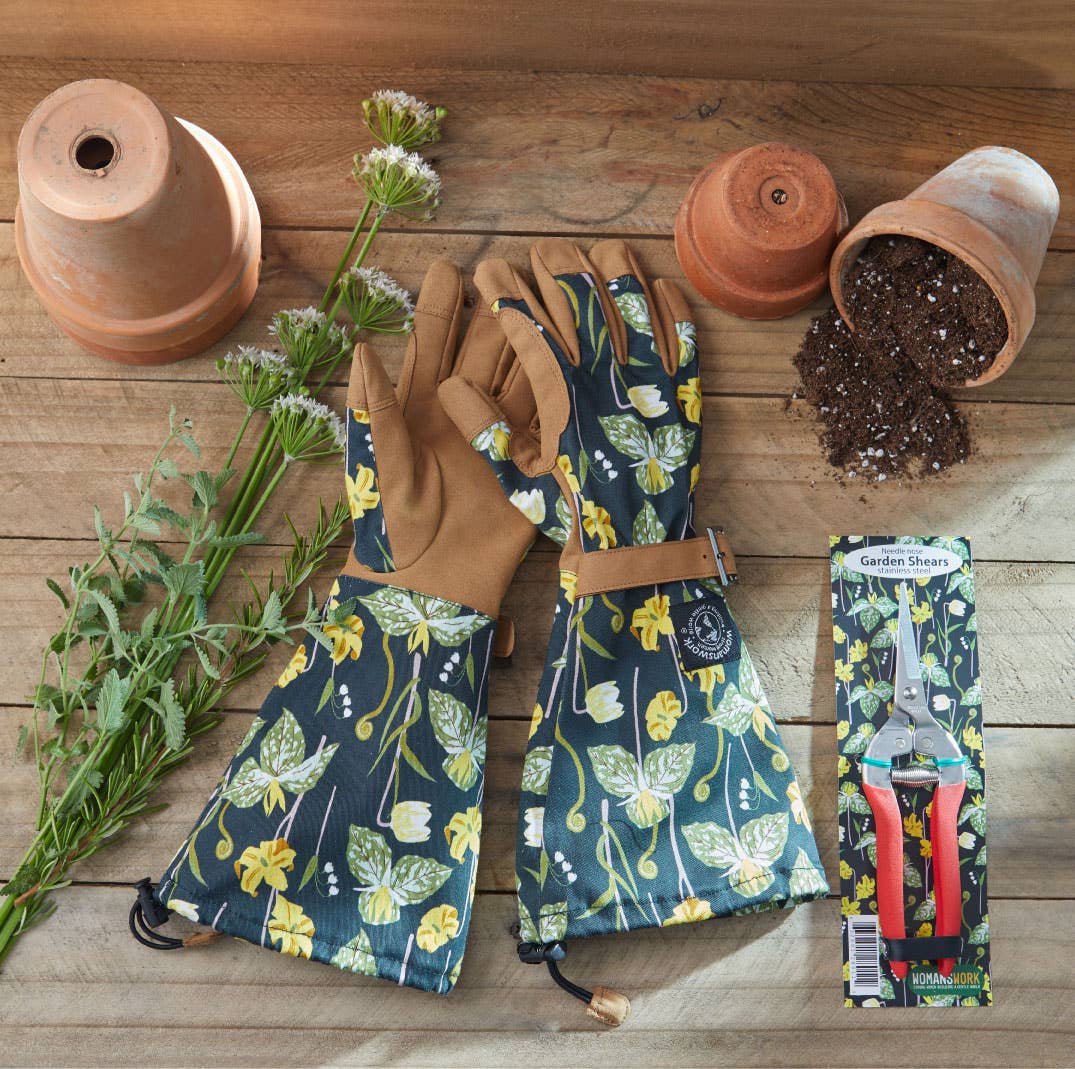 Barking Gardener floral print arm saver gloves and stainless steel compact garden shears on a wooden surface
