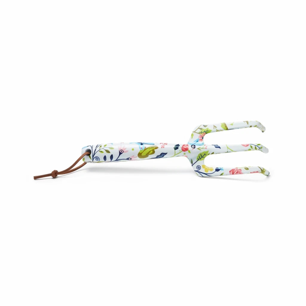 Barking Gardener floral patterned metal hand cultivator with a rustic leather hanging loop on a white background