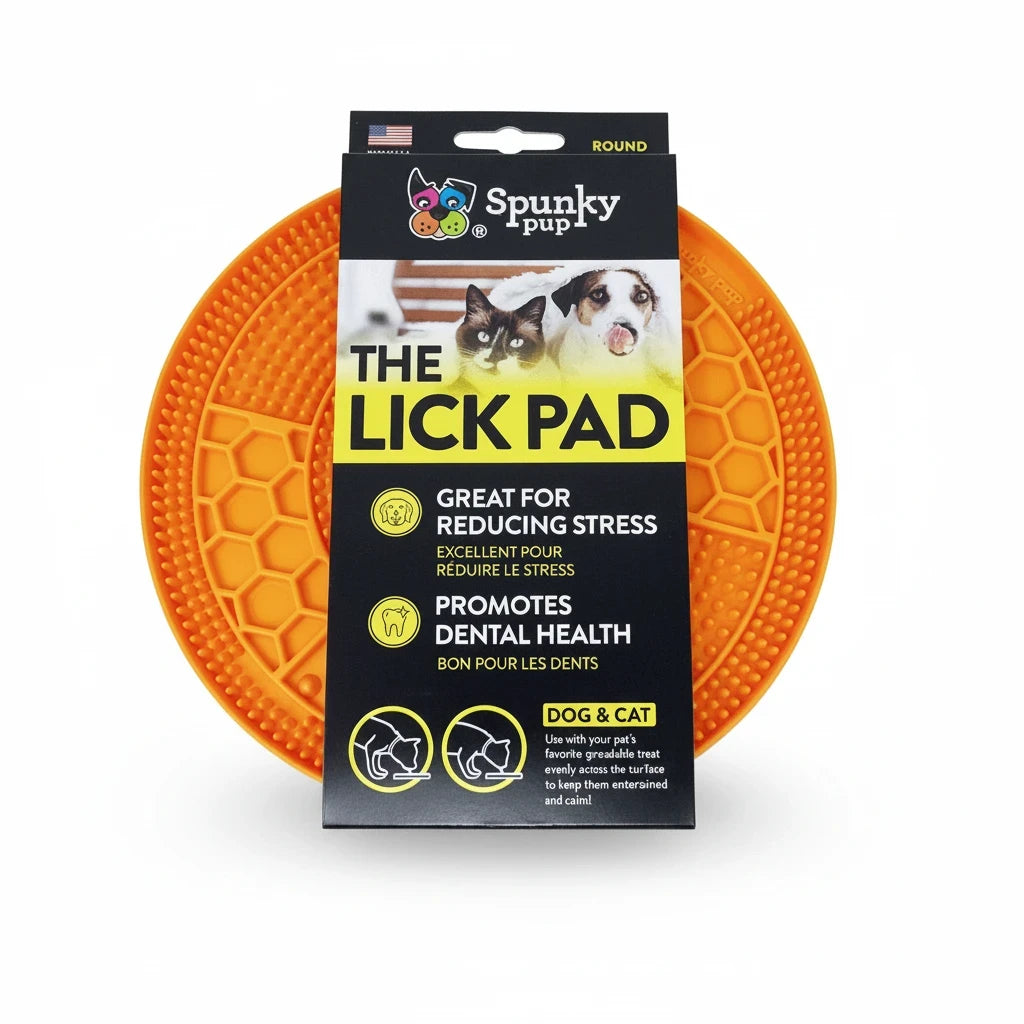Barking Gardener round orange Spunky Pup lick pad for dogs and cats with textured surface for treat spreading