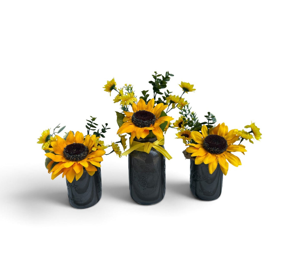 Barking Gardener farmhouse faux sunflower arrangement in three dark grey mason jars with yellow ribbon accents